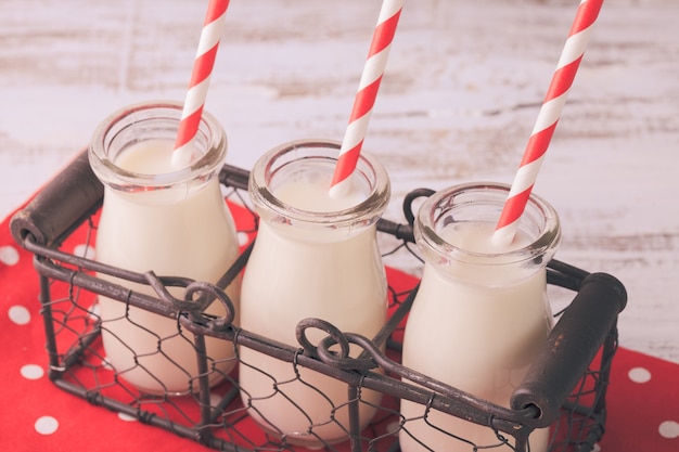 Milk in bottles with paper straws for children