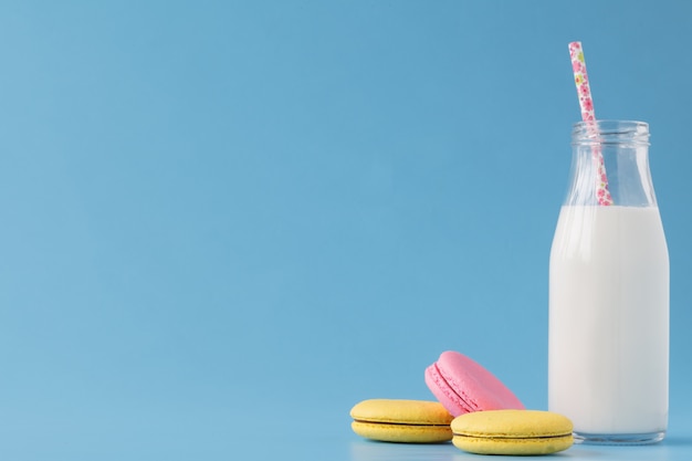 Milk bottles with retro striped straws