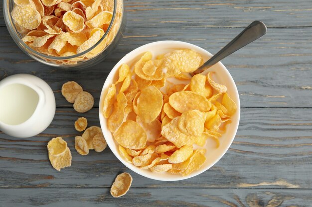 Milk, bowl and jar of muesli