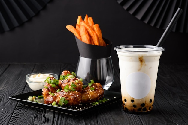 Milk bubble tea with tapioca and fried chicken with sweet potatoes