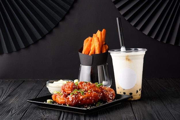 Milk bubble tea with tapioca and fried chicken with sweet potatoes