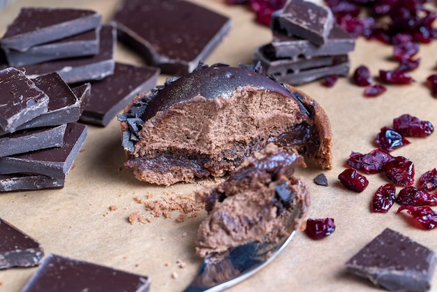 A milk chocolate bar broken into a large number of pieces pieces of milk chocolate are lying on the table