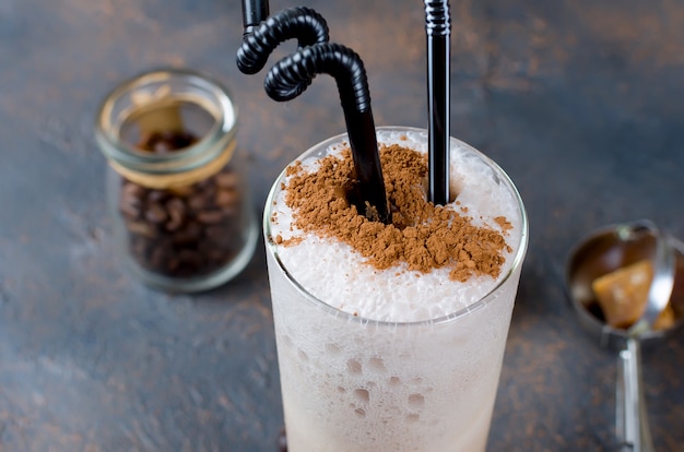 Milk chocolate cocktail or cold whipped coffee with milk