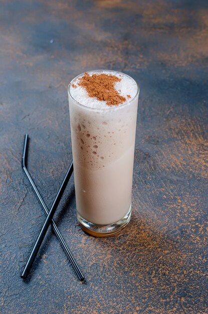 Milk chocolate cocktail or cold whipped coffee with milk