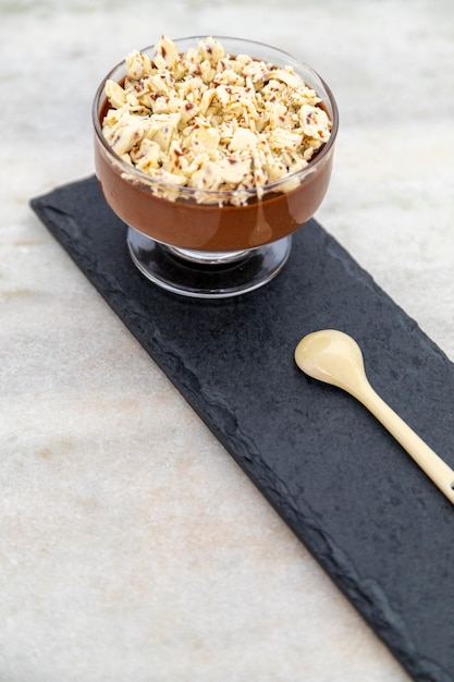 Milk chocolate mousse with chocolate shavings.