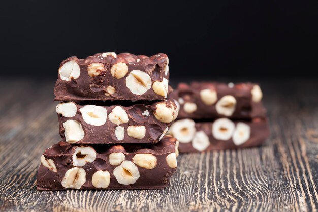 Milk chocolate with whole and chunks of hazelnuts