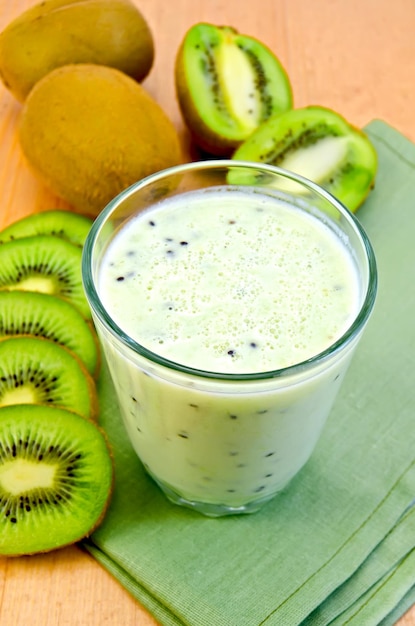 Milk cocktail with kiwi on a napkin