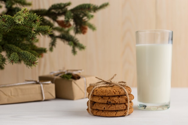 Milk and cookies for Santa Claus under the christmas tree