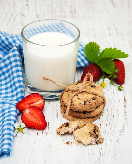 Milk, cookies and strawberries