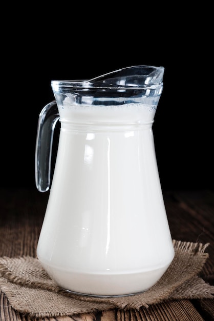 Milk on a dark wooden background