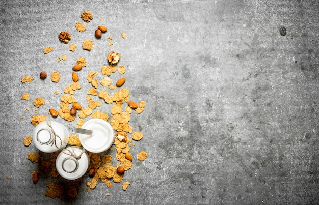 Milk dessert cereal and nuts. On the stone table.