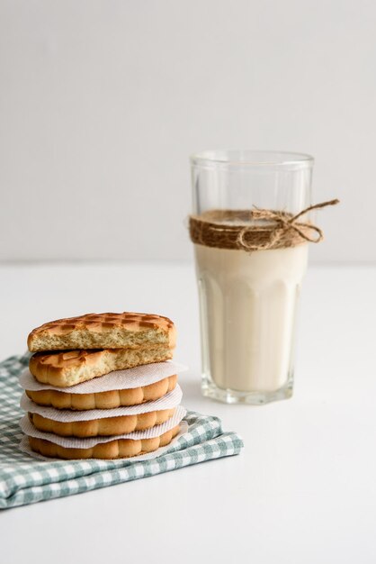 Milk in a glass and cookies on the table