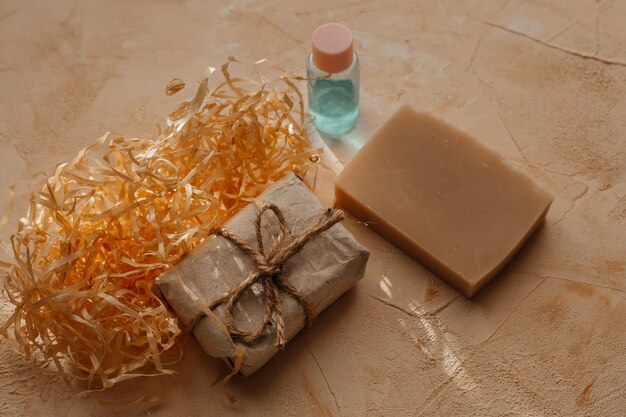 milk handmade soap and cosmetics bottle on a texture beige background. natural soap and beauty