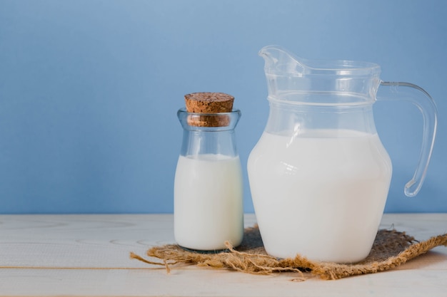 Milk in jug with blue background