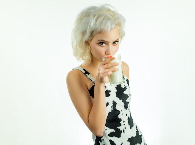 Milk matters. Sensual woman drinking regular milk. Adorable girl holding glass of milk. Pretty woman enjoying natural cows milk