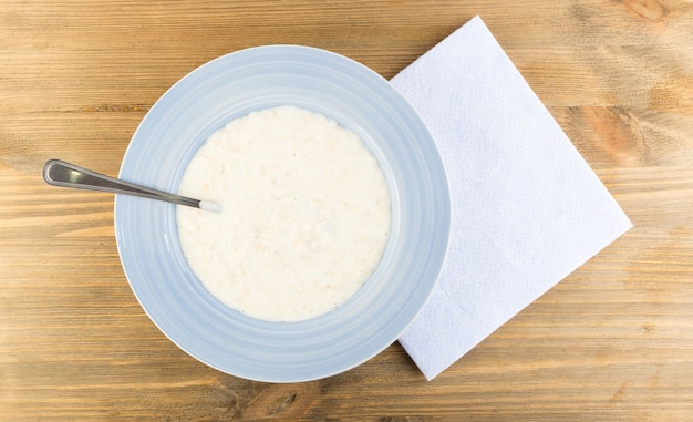 Milk Porridge in Blue Plate  Top View