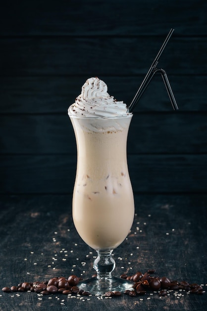 Milk shake On a black wooden background Copy space