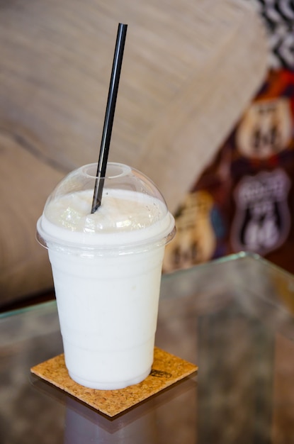 Milk smoothie on glass table