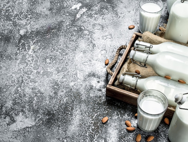 Milk table. Fresh milk in a wooden tray.