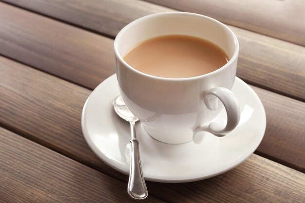 Milk tea on wooden background