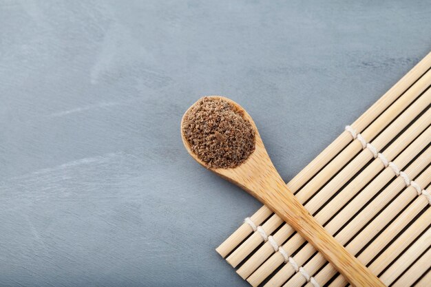 Milk Thistle powder or Silybum marianum extract in wooden spoon