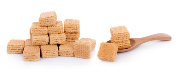 Milk wafers cubes on spoon 