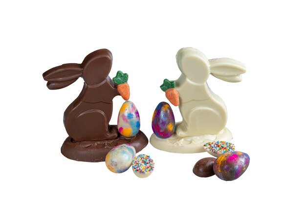 Milk and white chocolate bunnies next to small chocolate eggs_3