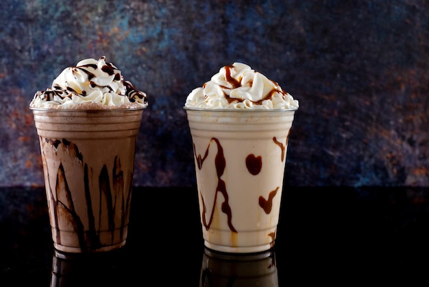 Milkshakes of different flavors on a dark background