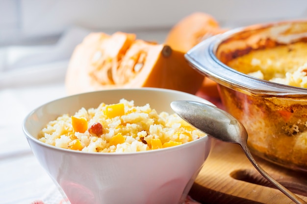 Milky cereal porridge with pumpkin and raisins