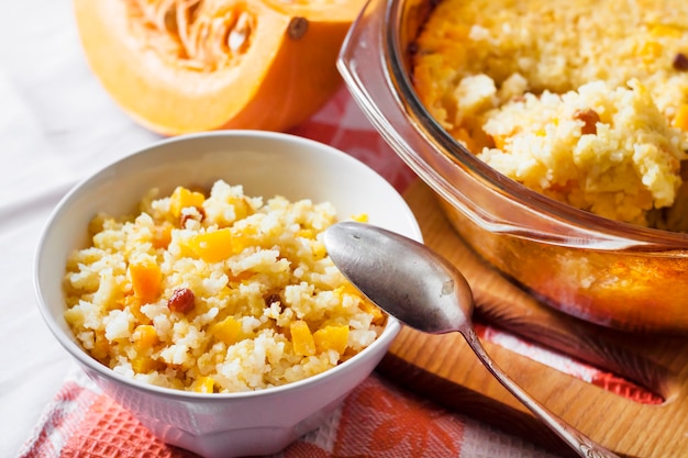 Milky cereal porridge with pumpkin and raisins