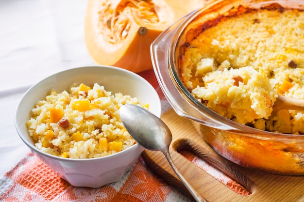 Milky cereal porridge with pumpkin and raisins