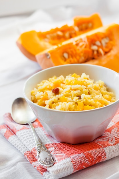 Milky cereal porridge with pumpkin and raisins