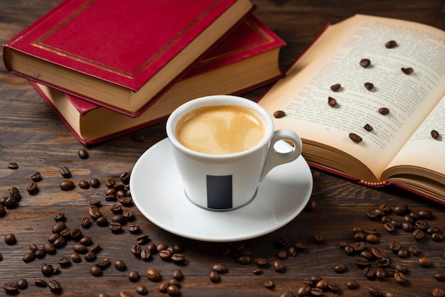 Photo milky coffee with beans and book decoration