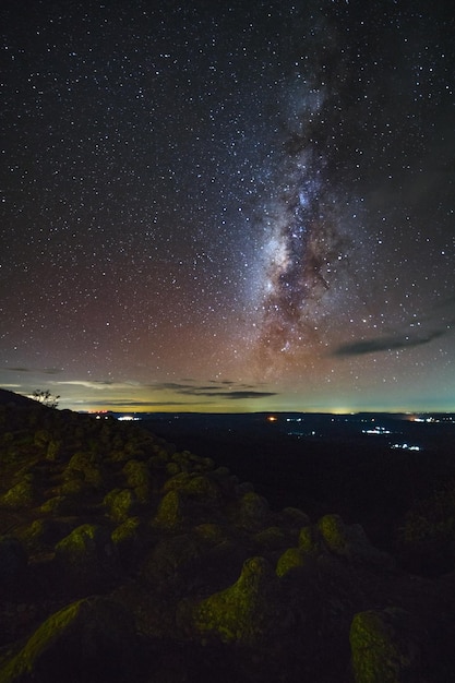 Milky way galaxy with knob stone ground is name Lan Hin Pum viewpoint at Phu Hin Rong Kla National Park in Phitsanulok Thailand