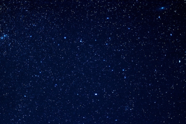 Milky way galaxy with stars and space dust in the universe long exposure photograph with grain