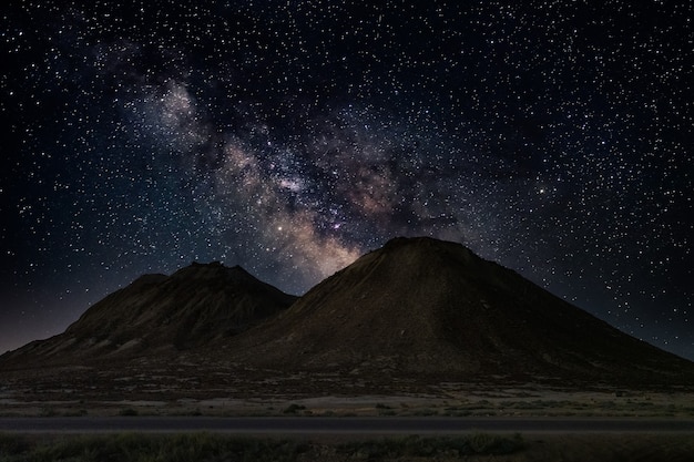 Milky way over hills, night landscape