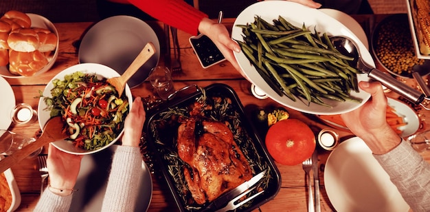 Millennial adult friends celebrating Thanksgiving together at home