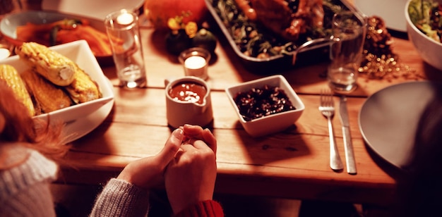 Millennial adult friends celebrating Thanksgiving together at home