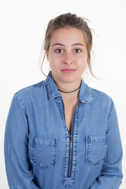 millennial confident young woman wearing blue jeans shirt in white background