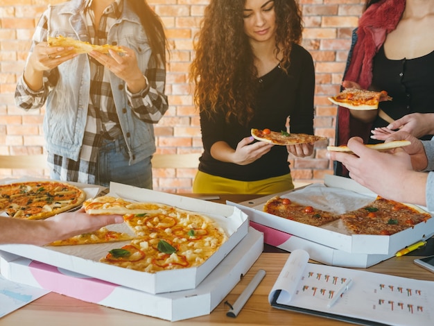 millennials lifestyle.  pizza dinner break. fast food fans.