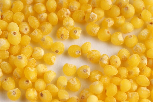 Millet on a white surface closeup