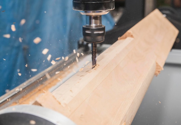 milling machine with Computer numerical control processes wood blank at high speed