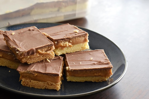 Millionaire's shortbread with chocolate and caramel on a plate
