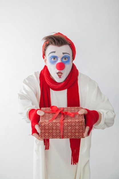 Mime boy with a gift in his hands