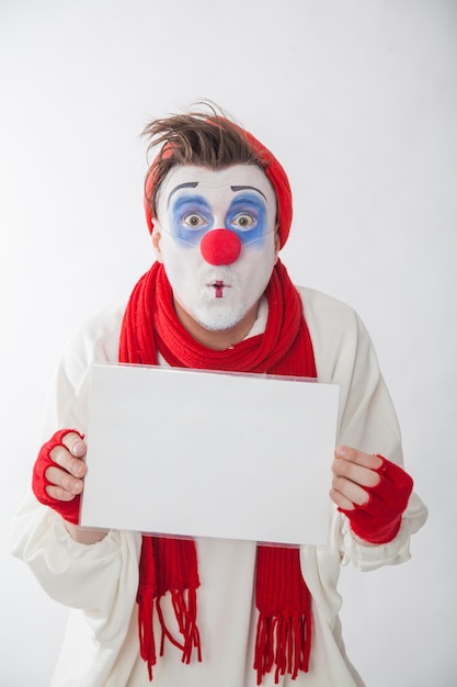 Photo mime boy with a white sign for the inscription