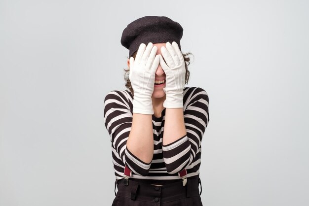 Mime caucasian woman covering her eyes waiting for surprise