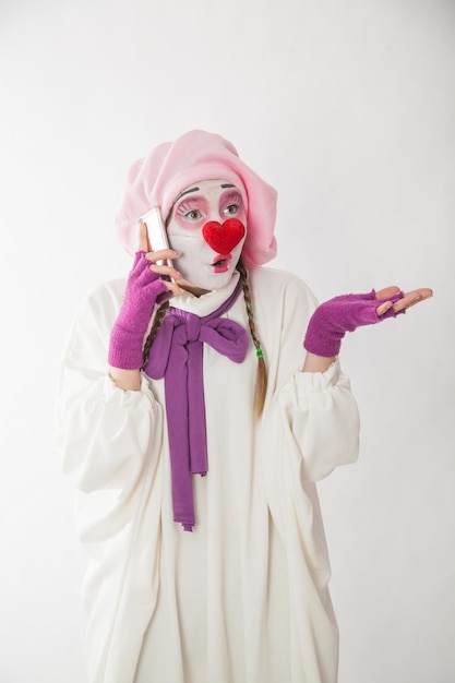 Mime girl with a phone in her hands