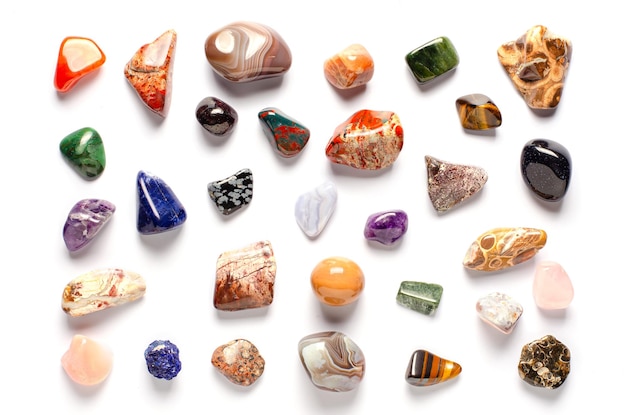 Mineral stones on a white background The concept of using minerals and crystals in astrology and alternative or complementary medicine