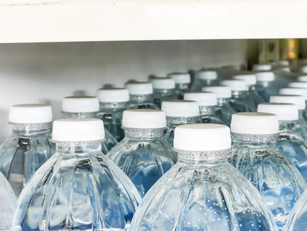 Photo mineral water bottle caps in the row.