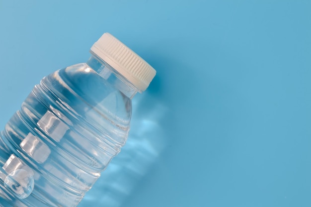 Mineral water isolated on a blue background